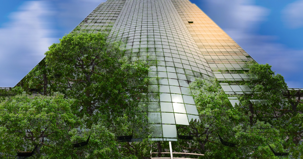 A tall building covered with trees and greenery