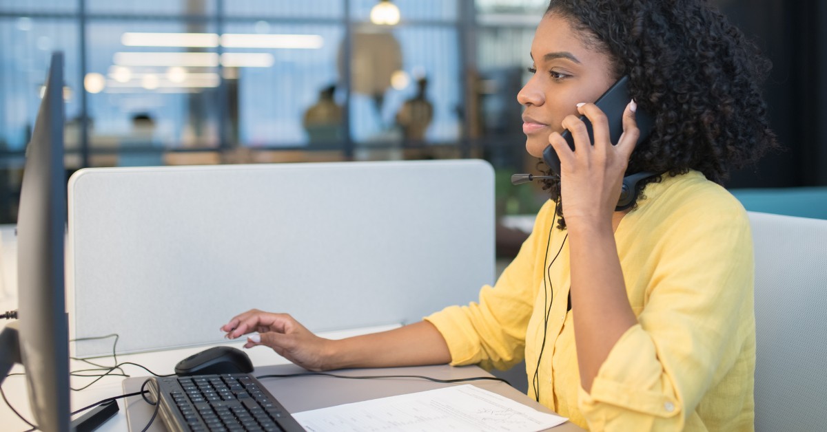 A woman on a phone in an office