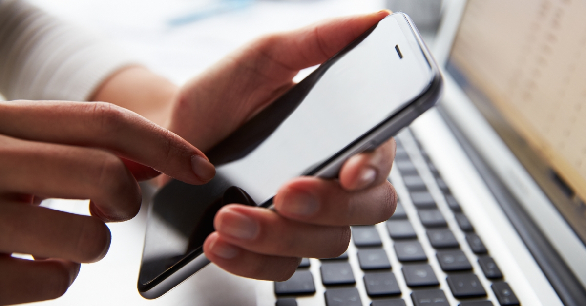A person holding a mobile phone