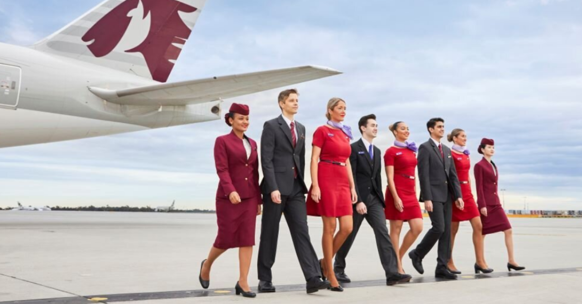 Airline staff walking beside a plane