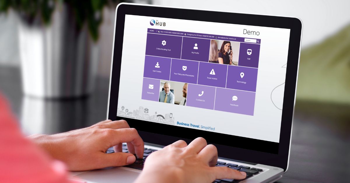 Hands typing on a laptop