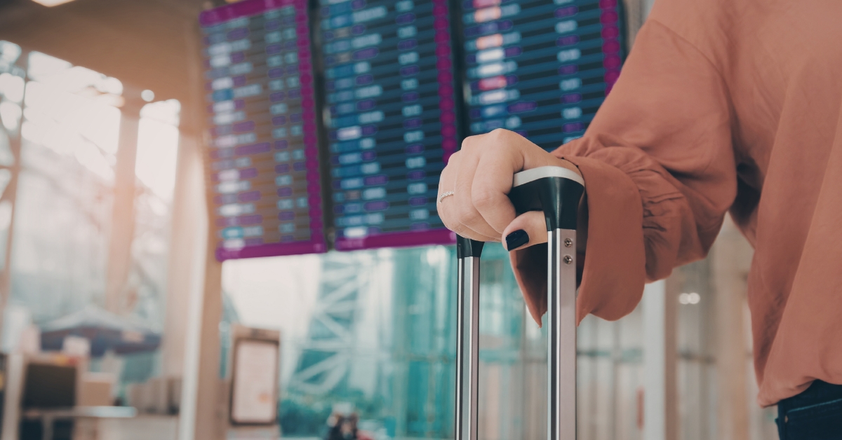 Woman with a carry on luggage at the airport