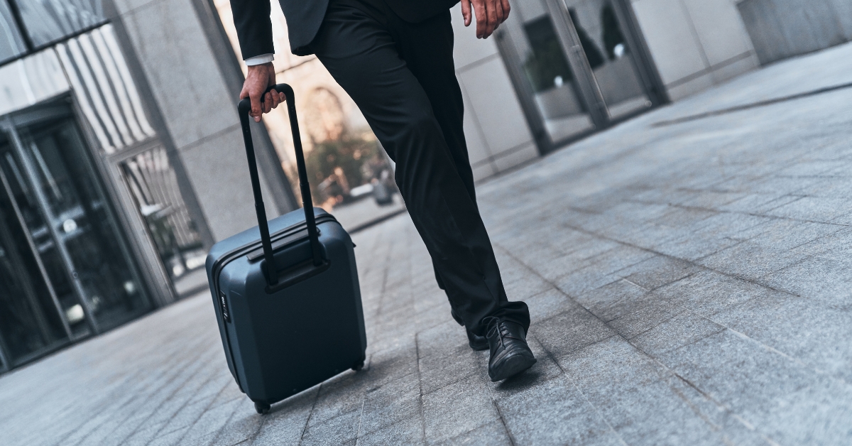 Man carrying a suitecase