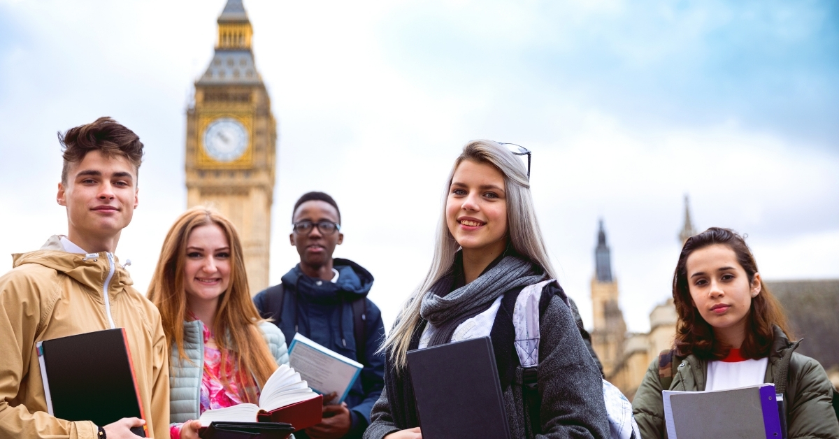 A group of people standing in front of Big Ben
